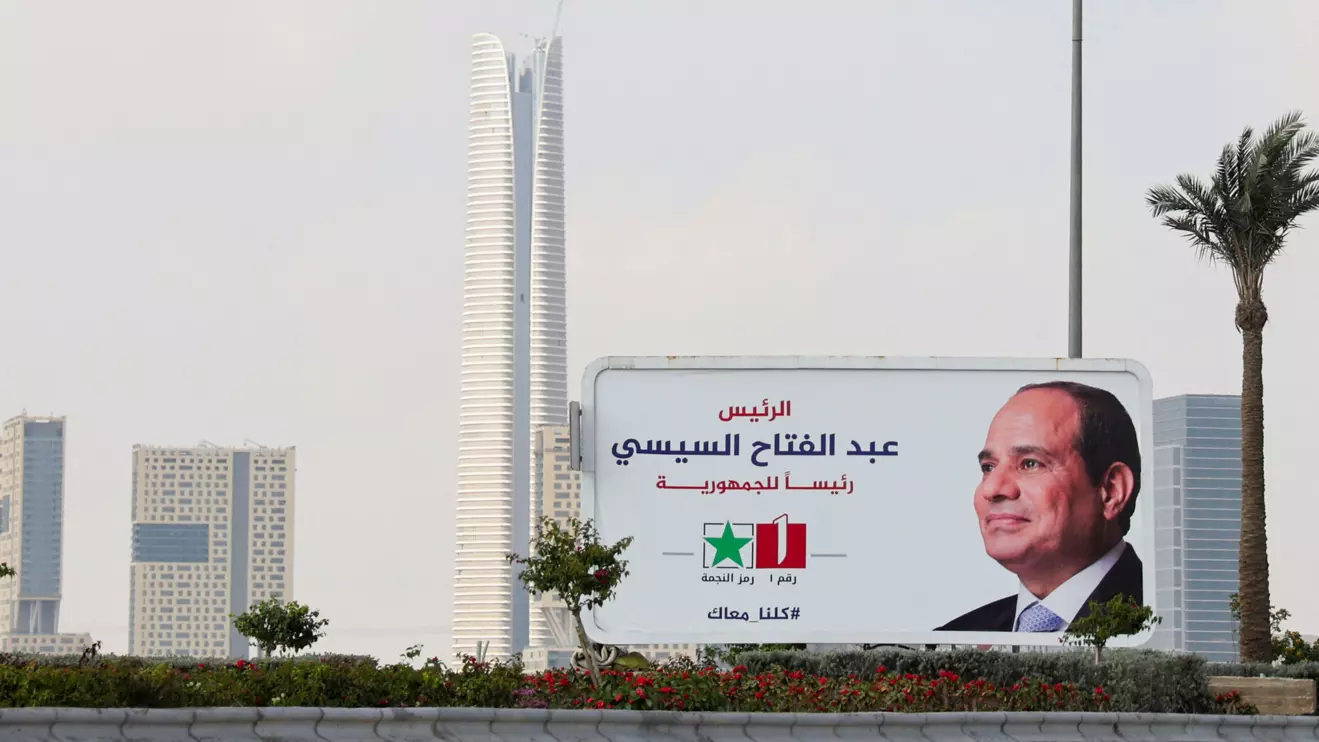 A banner of presidential candidate and current Egyptian President Abdel Fattah al-Sis stands next to the Central Business District (CBD), which is being built by China State Construction Engineering Corp (CSCEC) in the New Administrative Capital (NAC), east of Cairo, Reuters/Amr Abdallah Dalsh