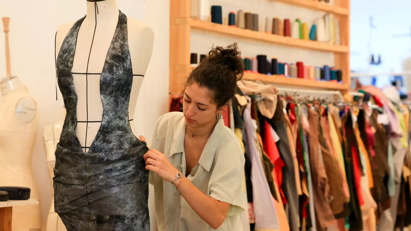A woman works on a dress at 'Creative Space Beirut', a fashion school in Beirut, Lebanon. Reuters/Mohammad Azakir