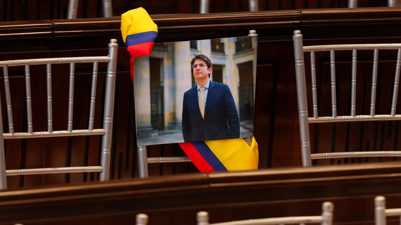 A picture of Colombian Senator Miguel Uribe Turbay of the opposition Democratic Center party hangs from a chair during the opening of the new session of the Colombian Congress, in Bogota, Colombia, July 20, 2025. Reuters/Luisa Gonzalez