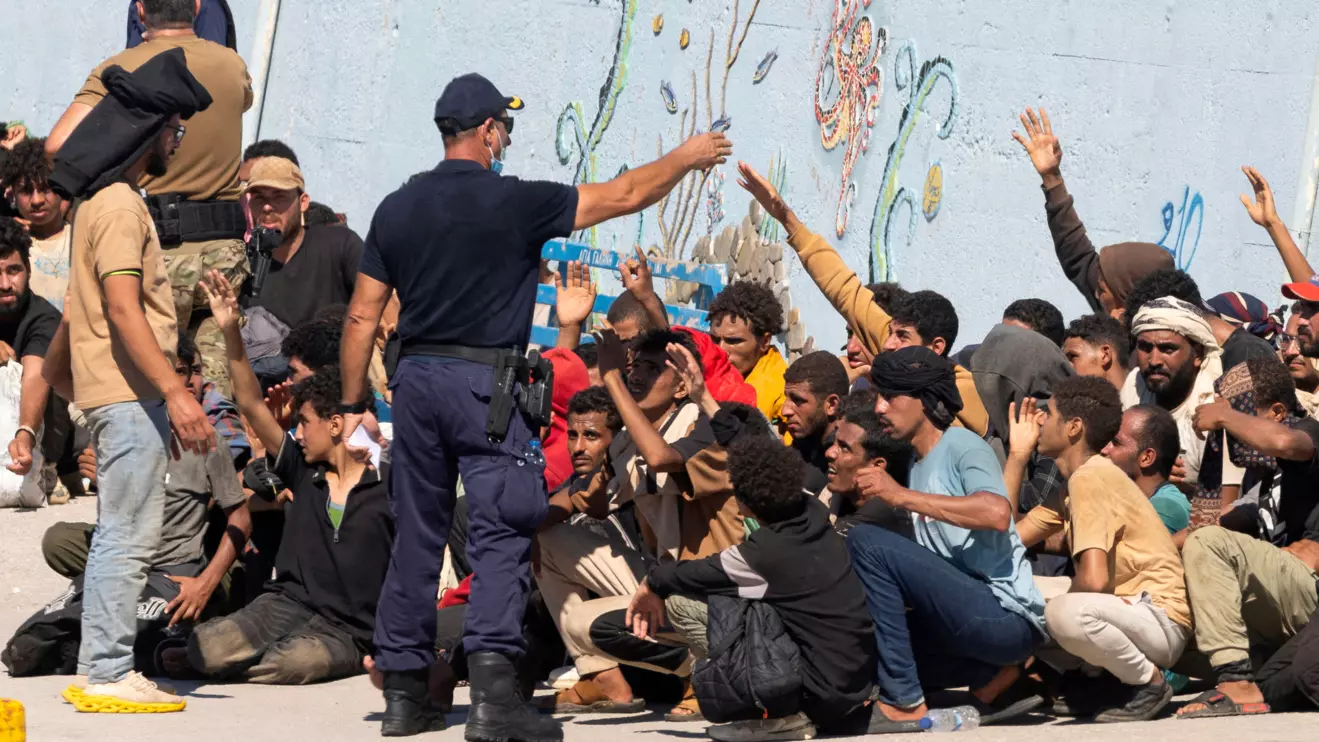 Migrants talk with the authorities, after Greece rescued hundreds of migrants off the islands of Gavdos and Crete in separate incidents, according to the Greek Coast Guard, in the port of Agia Galini, Greece, July 6, 2025. Reuters/Stefanos Rapanis