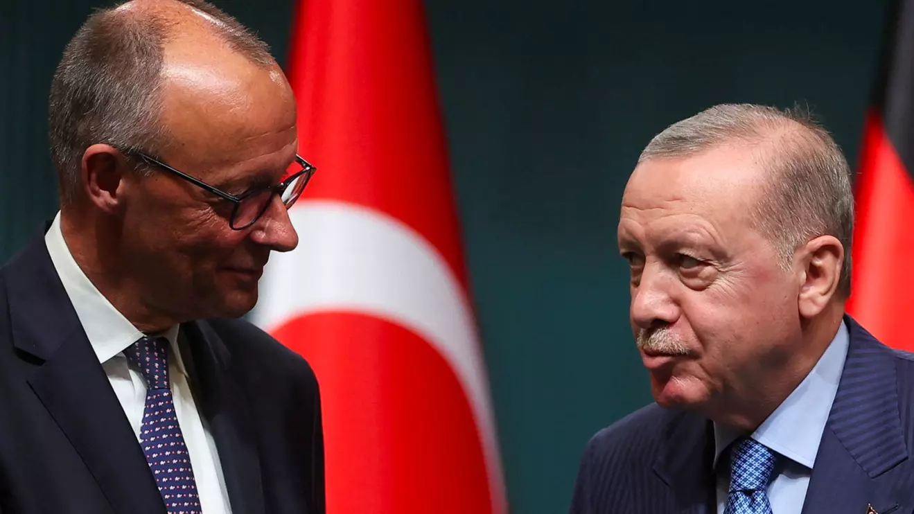 Turkish President Tayyip Erdogan and German Chancellor Friedrich Merz shake hands as they attend a press conference at the Presidential Palace in Ankara, Turkey, October 30, 2025. Reuters/Umit Bektas