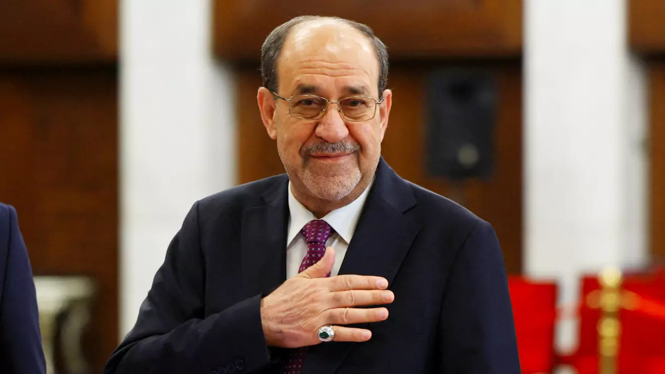 Former Iraqi Prime Minister Nouri al-Maliki reacts at a polling station inside Al-Rasheed Hotel during the parliamentary election in Baghdad, Iraq, November 11, 2025. Reuters/Thaier Al-Sudani