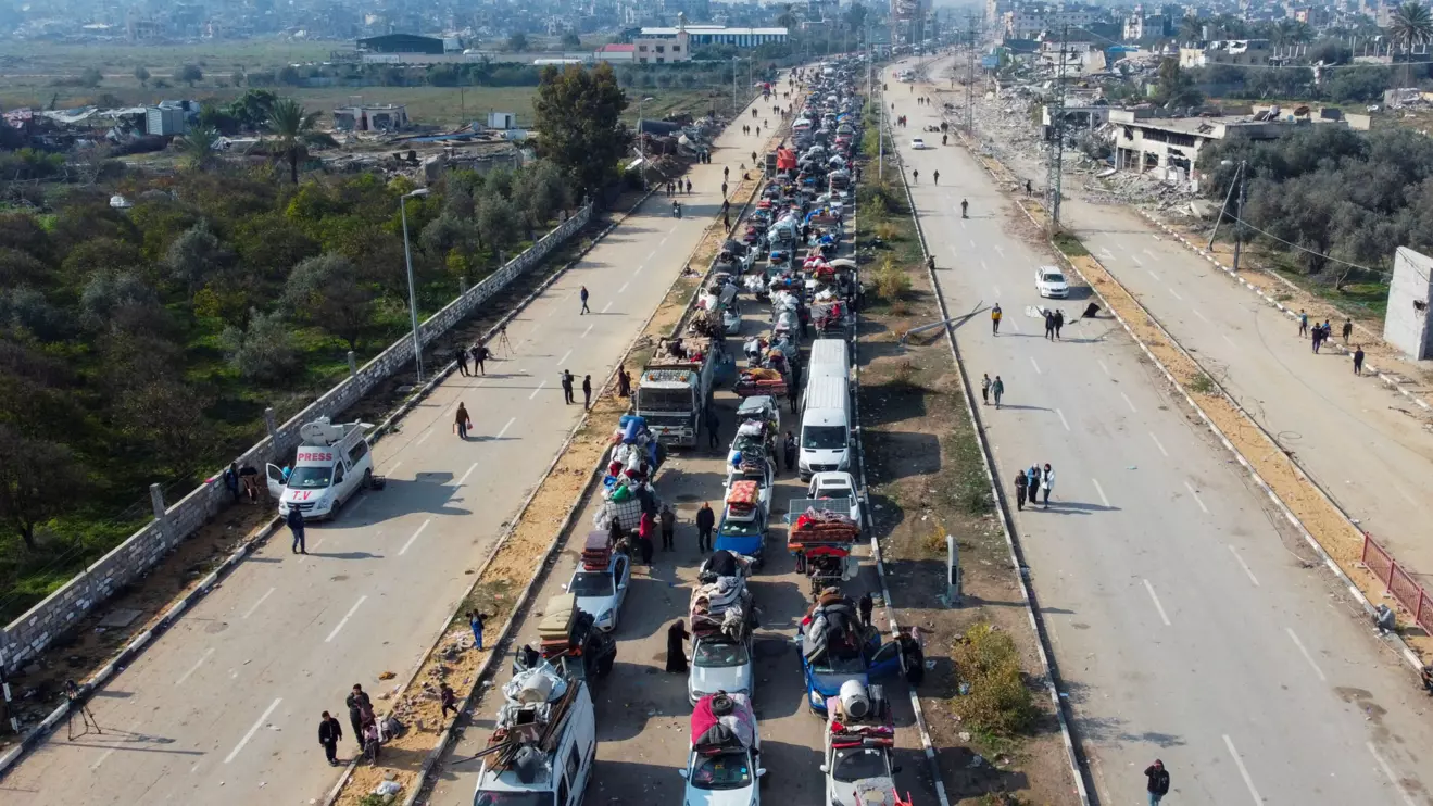 A drone view shows displaced Palestinians waiting to have their vehicles inspected by the Egyptian-Qatari committee as they return to their homes in northern Gaza from the south, at Salahudeen Road, amid a ceasefire between Israel and Hamas, in the central Gaza Strip, January 28, 2025. Reuters/Mohammed Salem
