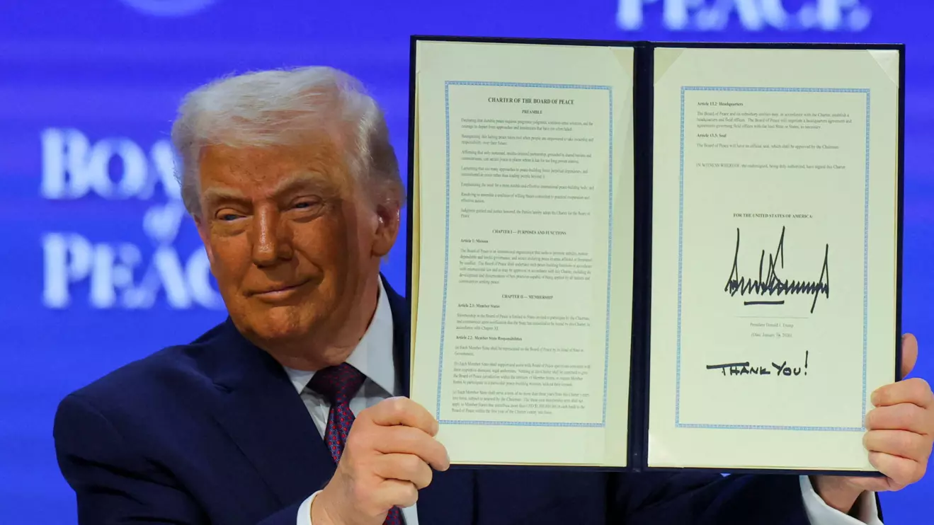 U.S. President Donald Trump holds a signed Charter of the Board of Peace, as he takes part in a charter announcement for his Board of Peace initiative aimed at resolving global conflicts, alongside the 56th annual World Economic Forum (WEF), in Davos, Switzerland, January 22, 2026. Reuters/Denis Balibouse