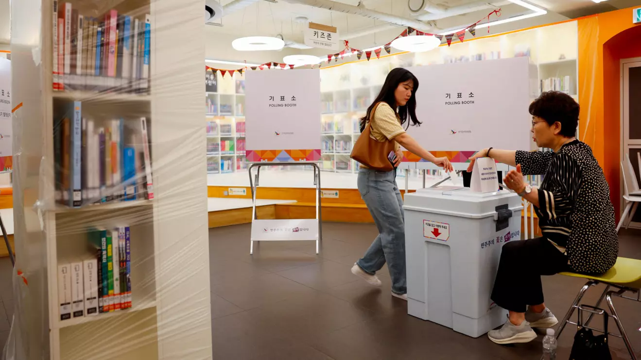A woman votes at a polling station set up at a book cafe library, during the presidential election in Seoul, South Korea, June 3, 2025. Reuters/Kim Soo-hyeon
