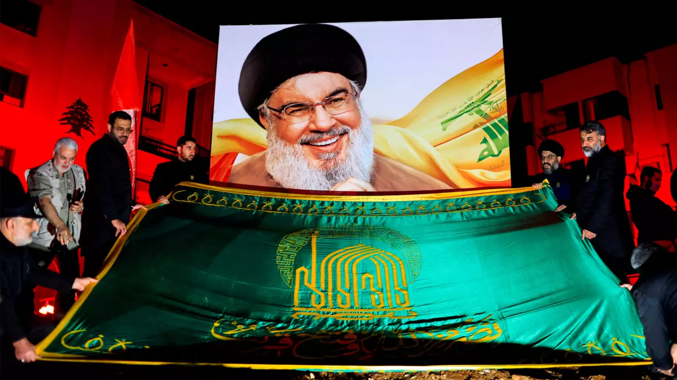 People gather at a site damaged by Israeli airstrike that killed Lebanon's Hezbollah leader Sayyed Hassan Nasrallah during a commemoration ceremony in Beirut southern suburbs, Lebanon November 30, 2024. Reuters/Thaier Al-Sudani