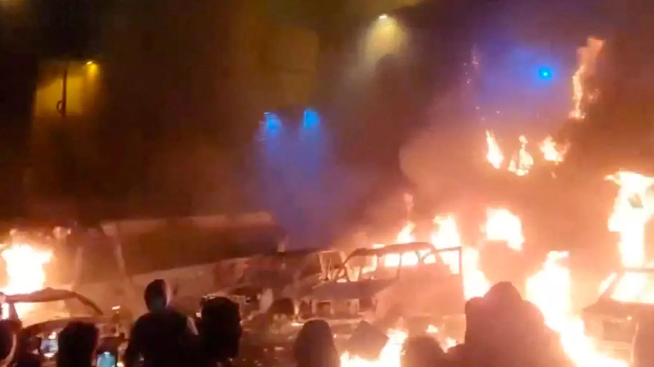 Protesters gather as vehicles burn, amid evolving anti-government unrest, in Tehran, Iran, in this screen grab obtained from a social media video released on January 9, 2026