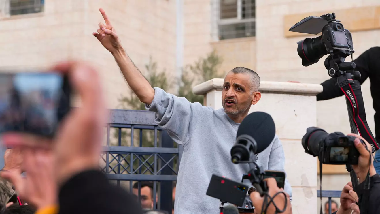 A freed Palestinian prisoner gestures after he was released from an Israeli jail as part of a hostages-prisoners swap and a ceasefire deal in Gaza between Hamas and Israel, in Ramallah, in the Israeli-occupied West Bank, January 25, 2025. Reuters/Ali Sawafta