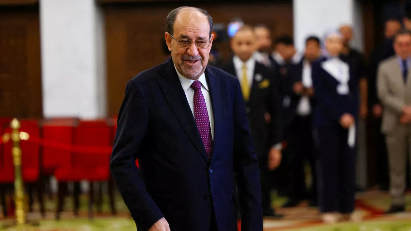 Former Iraqi Prime Minister Nouri al-Maliki walks at a polling station inside Al-Rasheed Hotel during the parliamentary election in Baghdad, Iraq, November 11, 2025. Reuters/Thaier Al-Sudani