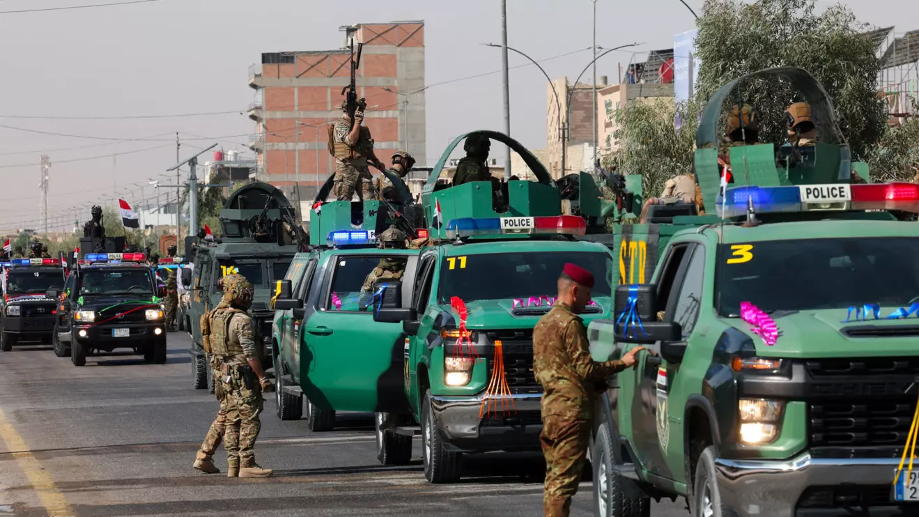 Members of the Iraqi security forces take part in a convoy moving through the city as they celebrate the withdrawal of US-led coalition forces from Iraq, ending a military presence that began after the 2003 US-led invasion, in Najaf, Iraq, September 30, 2026. Reuters/Alaa Al-Marjani