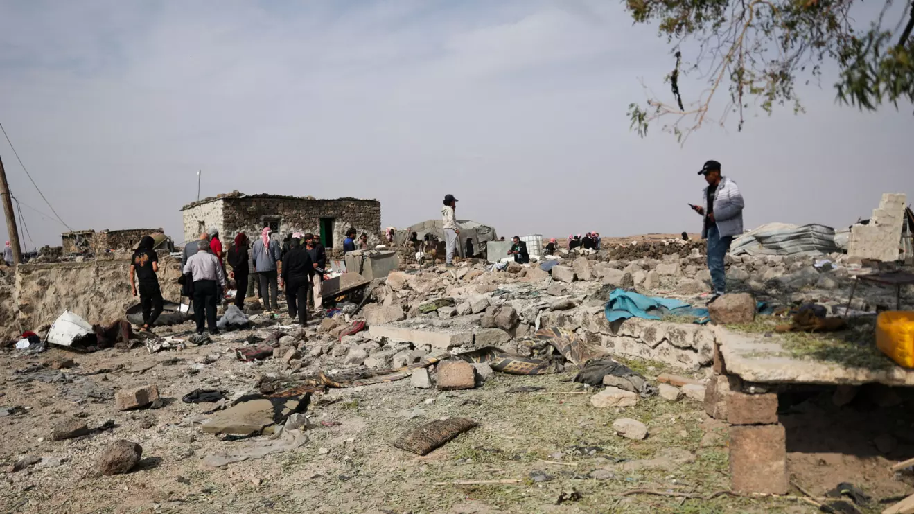 People inspect the site of a reported Jordanian airstrike where four members of the same family, including three children, were killed, in the town of Al-Mismiyah, in Syria's southern Daraa province, October 27, 2026. Reuters/Khalil Ashawi