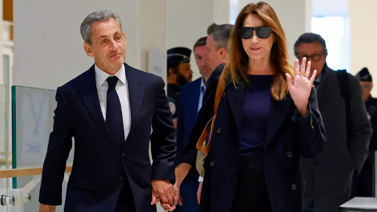 Former French President Nicolas Sarkozy arrives with his wife Carla Bruni-Sarkozy for the verdict in his trial with other defendants on charges of corruption and illegal financing of an election campaign related to alleged Libyan funding of his successful 2007 presidential bid, at the courthouse in Paris, France, September 25, 2025. Reuters/Stephanie Lecocq