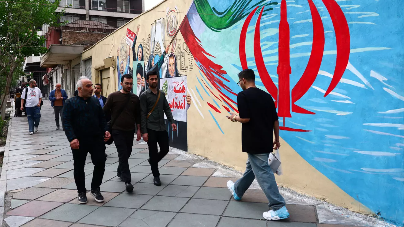 People walk on a street, amid a ceasefire between U.S. and Iran, in Tehran, Iran, April 20, 2026. Majid Asgaripour/WANA (West Asia News Agency) via Reuters