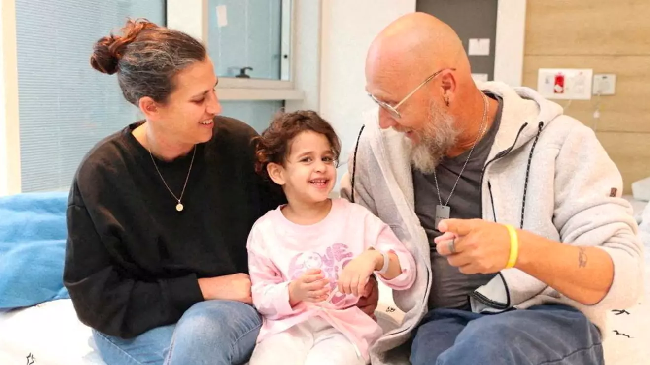 Avigail Idan, who was released after being taken hostage during the October 7 attack on Israel by the Palestinian militant group Hamas, talks with her aunt Leron and uncle Zoli, at Schneider Children's Medical Center of Israel in Petah Tikva, Israel, in this handout picture released by Schneider Children's Medical Center of Israel on November 27, 2023. Schneider Children's Medical Center of Israel
