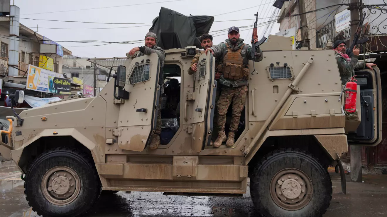Syrian army personnel look on from a military vehicle deployed inside the city of Tabqa, after the withdrawal of the Syrian Democratic Forces (SDF), in Tabqa, Syria, January 18, 2026. Reuters/Karam al-Masri