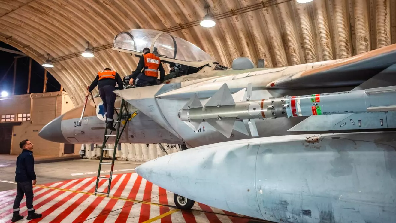 Crews work on an Israeli Air Force F-15 Eagle in a hangar, said to be following an interception mission of an Iranian drone and missile attack on Israel, in this handout image released April 14, 2024. Israel Defense Forces/Handout via Reuters