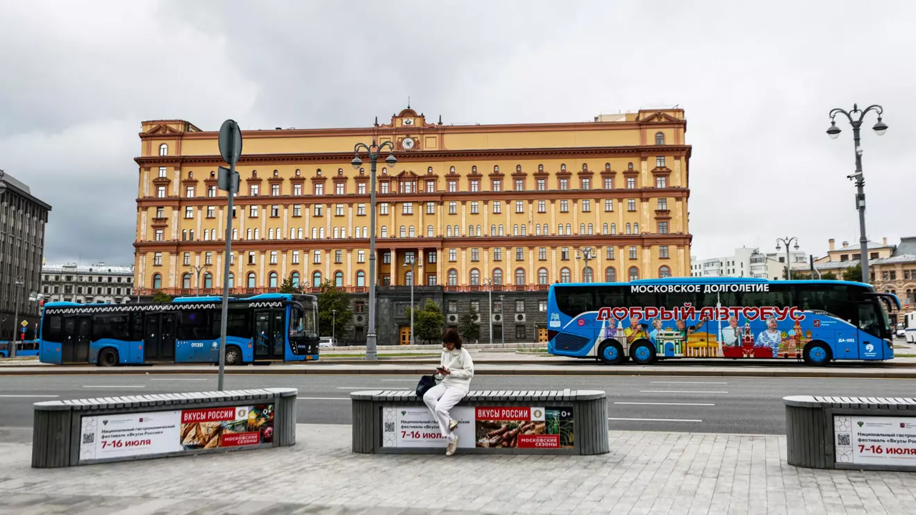 A woman uses her mobile phone in front of the Federal Security Service (FSB) building on Lubyanka Square in Moscow, Reuters/Maxim Shemetov