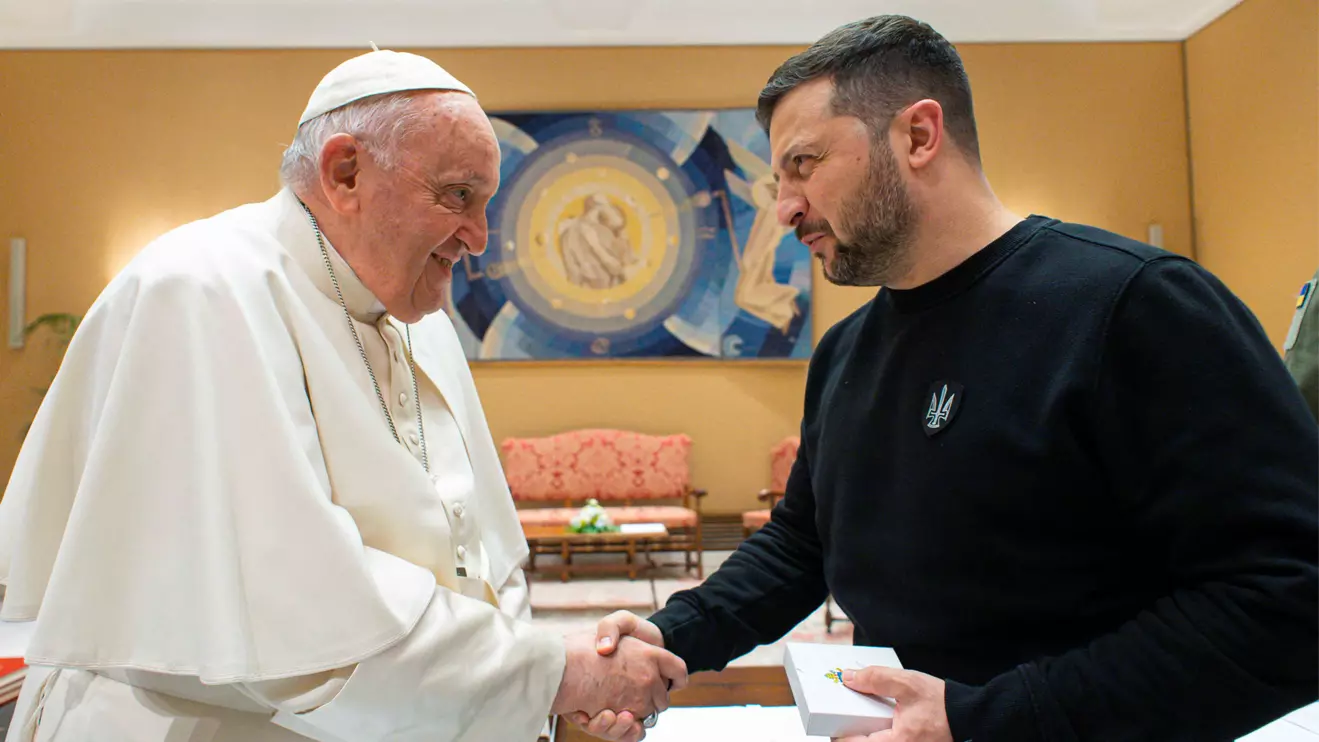 Pope Francis shakes hands with Volodymyr Zelenskiy, at the Vatican, May 13, 2023. Vatican Media via Reuters
