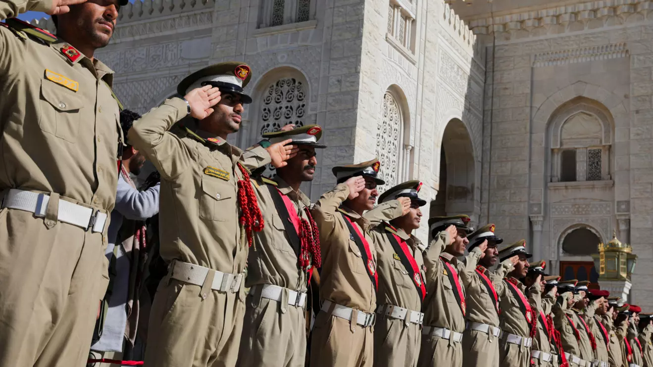 Military cadets salute during a military funeral procession for Houthi fighters killed in recent U.S.-led strikes on Houthi targets, in Sanaa, Reuters/Khaled Abdullah