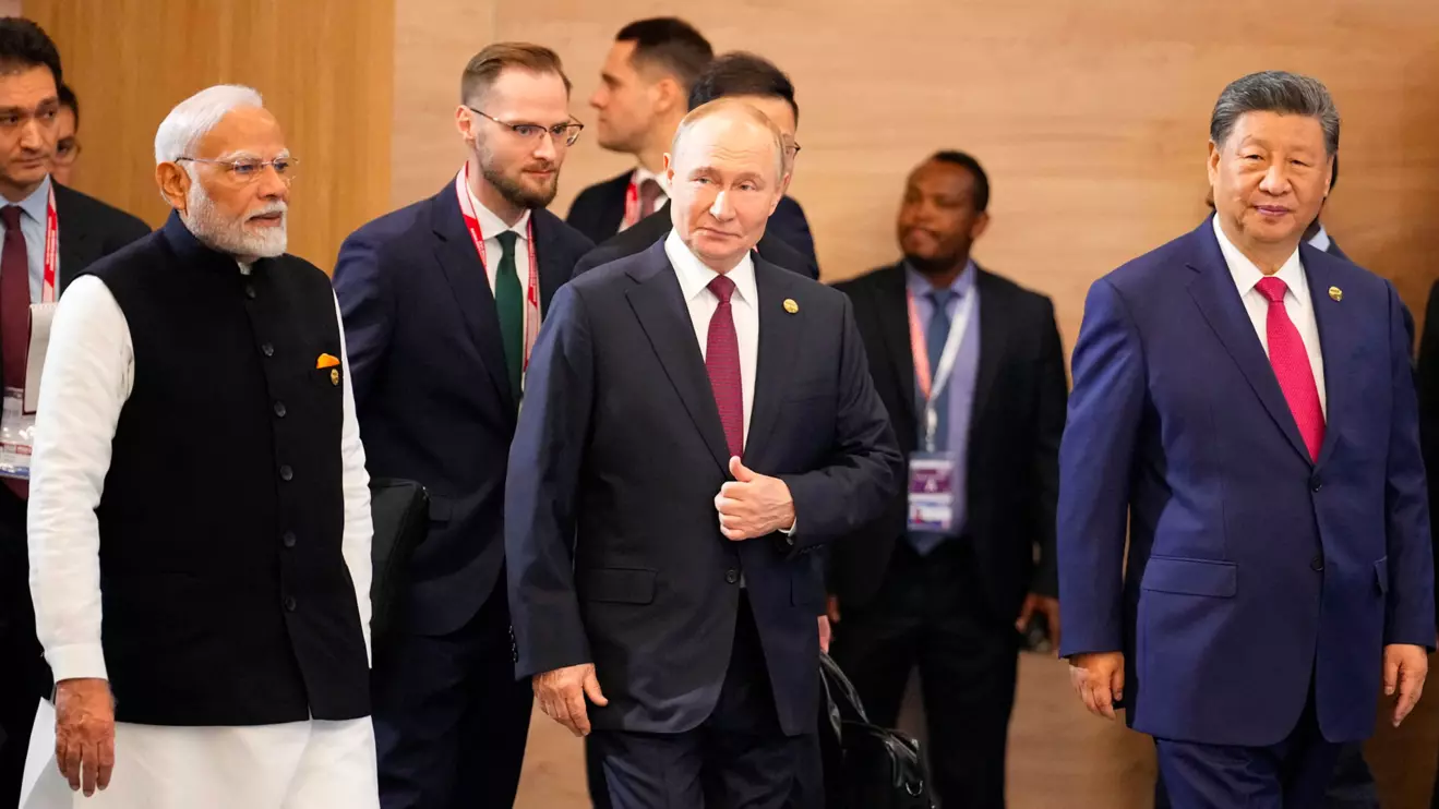 Indian Prime Minister Narendra Modi, Russian President Vladimir Putin and Chinese President Xi Jinping attend a family photo ceremony prior to the BRICS Summit plenary session in Kazan, Russia, Wednesday, Oct. 23, 2024. Alexander Zemlianichenko/Pool via Reuters