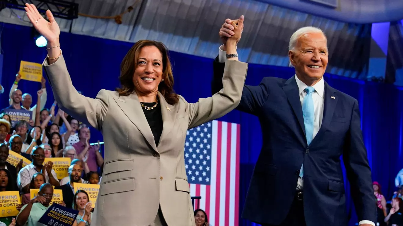 U.S. President Joe Biden raises the hand of Vice President Kamala Harris, at an event on Medicare drug price negotiations, in Prince George's County, Maryland, U.S., August 15, 2024. Reuters/Elizabeth Frantz