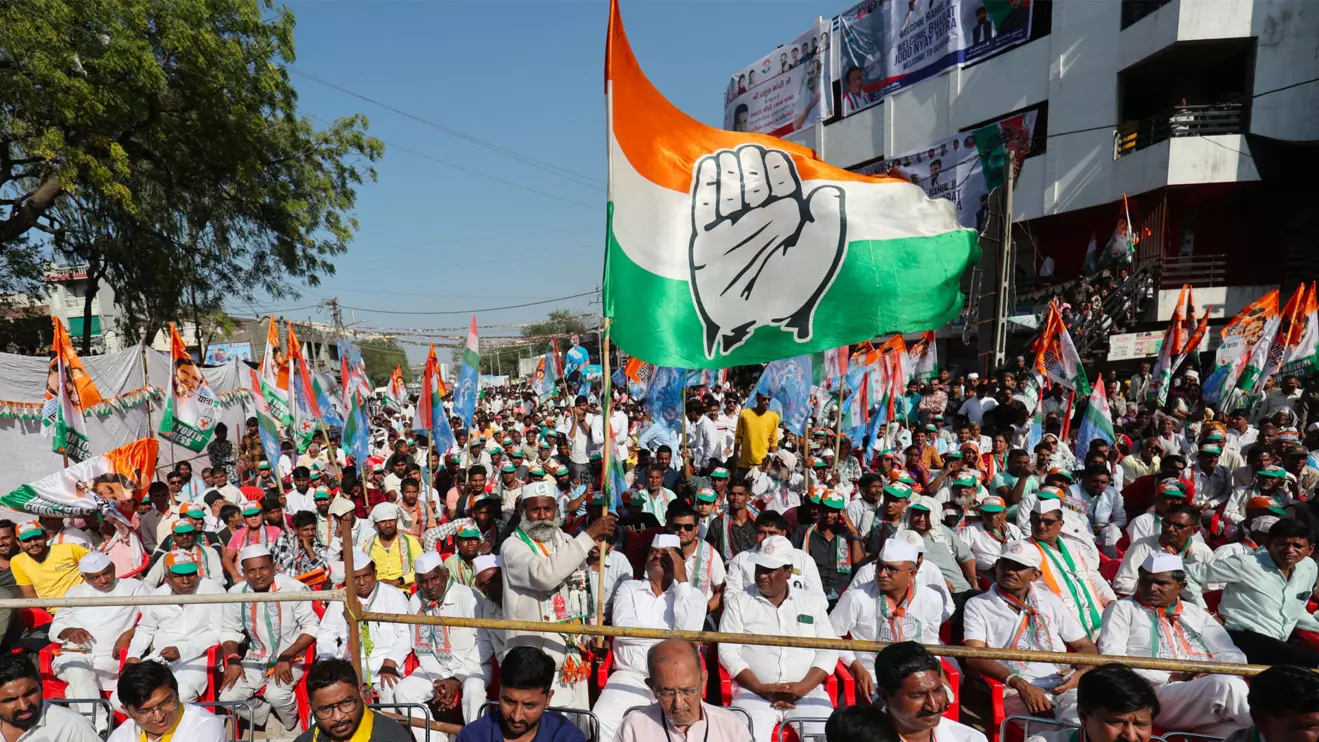 A supporter of Rahul Gandhi, a senior leader of India's main opposition Congress party, waves a party flag in a public meeting during Rahul's 66-day long "Bharat Jodo Nyay Yatra", or Unite India Justice March, in Jhalod town, Gujarat state, March 7, 2024. Reuters/Amit Dave