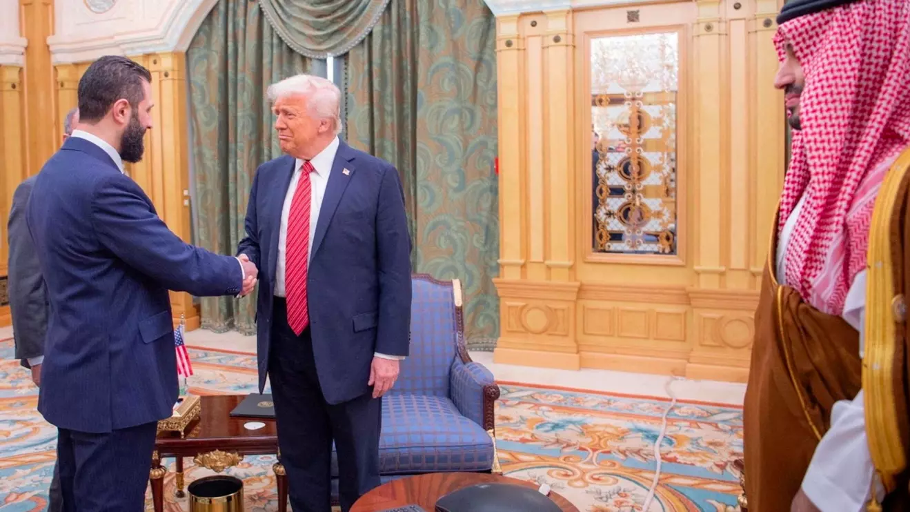 U.S. President Donald Trump meets with Syrian President Ahmed al-Sharaa in Riyadh, Saudi Arabia, in this handout released on May 14, 2025. Saudi Press Agency