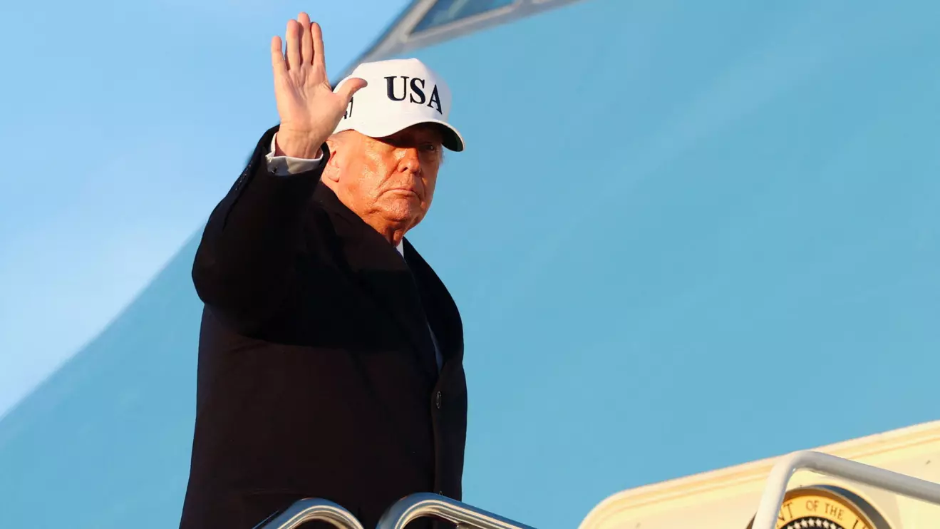 U.S. President Donald Trump waves as he boards Air Force One for travel to Florida, at Joint Base Andrews, Maryland, U.S., March 13, 2026. Reuters/Kevin Lamarque