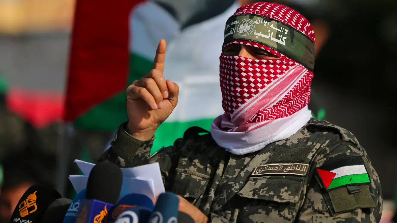 Abu Ubaida, the spokesman of the Izz el-Deen al-Qassam Brigades, gestures as he speaks during an anti-Israel military show in the southern Gaza Strip November 11, 2019. Reuters/Ibraheem Abu Mustafa