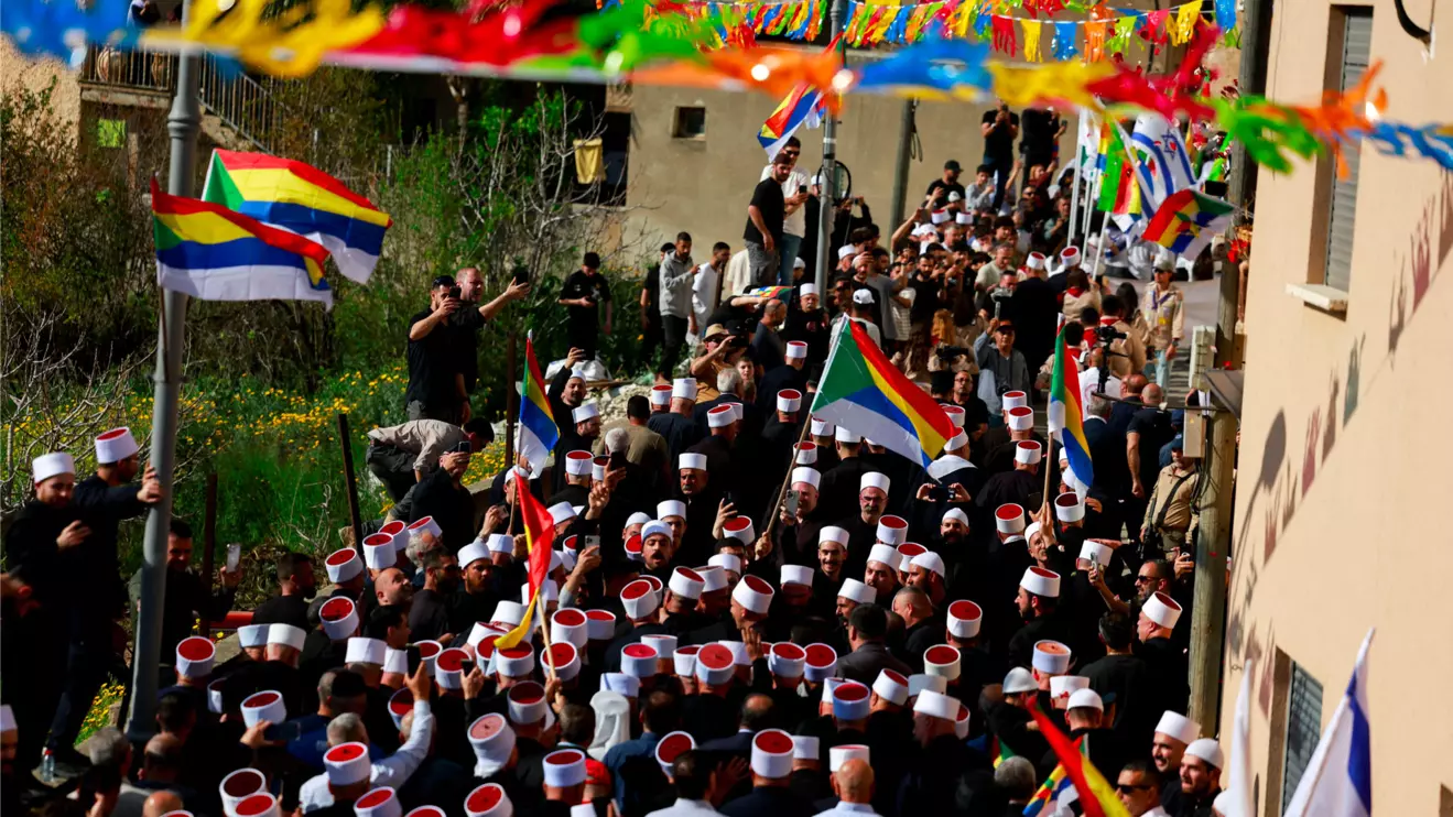 People gather on the day Israeli Druze leader Sheik Mowafaq Tarif and around 100 Syrian Druze religious elders, in the first Druze delegation from Syria just after 1973 war, visit the Nabi Shuayb Shrine, a holy place for the Druze community, in northern Israel March 14, 2025. Reuters/Ammar Awad