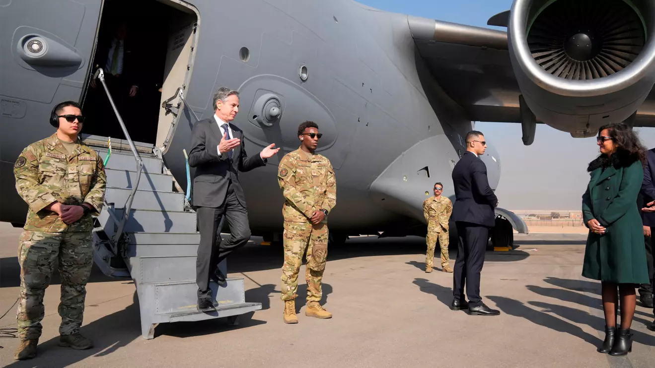 U.S. Secretary of State Antony Blinken is welcomed by Sarah Henry, Second Secretary at the Protocol Department of Egyptian Ministry of Foreign Affairs protocol, upon his arrival at Cairo Airport, in Cairo, February 6, 2024. Mark Schiefelbein/Pool via Reuters