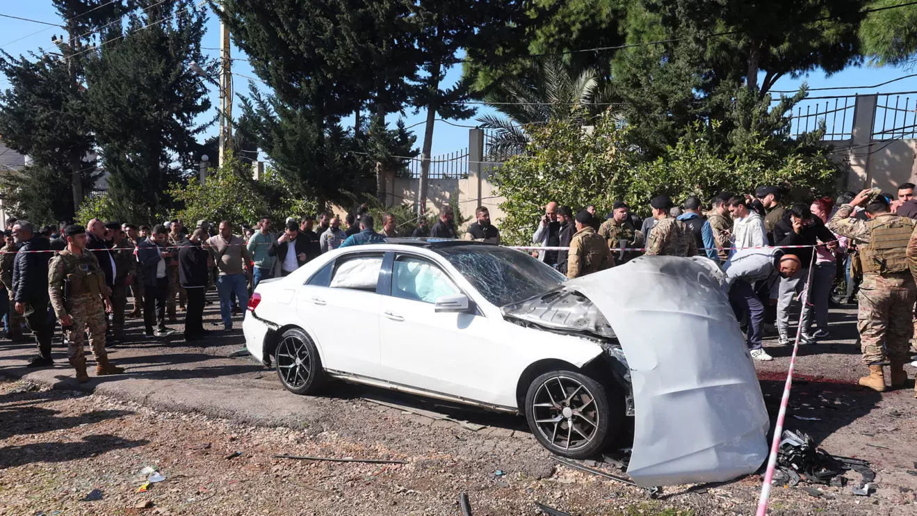 Members of the Lebanese army gather near a damaged vehicle in the aftermath of what security sources said was an Israeli strike, in Jadra, February 10, 2024. Reuters/Aziz Taher