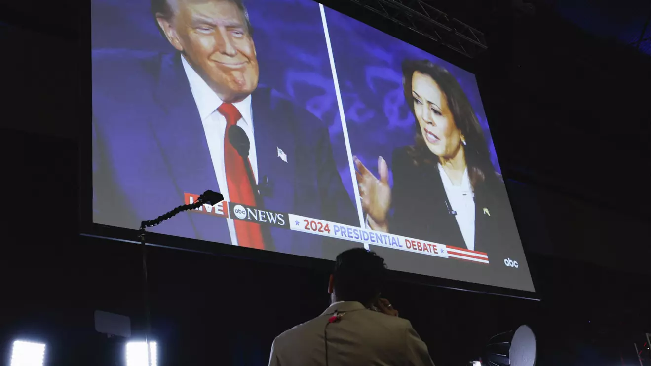 A screen displays the presidential debate hosted by ABC between Republican presidential nominee, former U.S. President Donald Trump and Democratic presidential nominee, U.S. Vice President Kamala Harris in Philadelphia, Pennsylvania, U.S., September 10, 2024. Reuters/Evelyn Hockstein