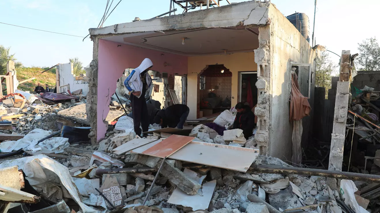 Palestinians inspect the site of an Israeli strike on a house, amid the ongoing conflict between Israel and Palestinian Islamist group Hamas, in Rafah in the southern Gaza Strip, January 16, 2024. Reuters/Arafat Barbakh