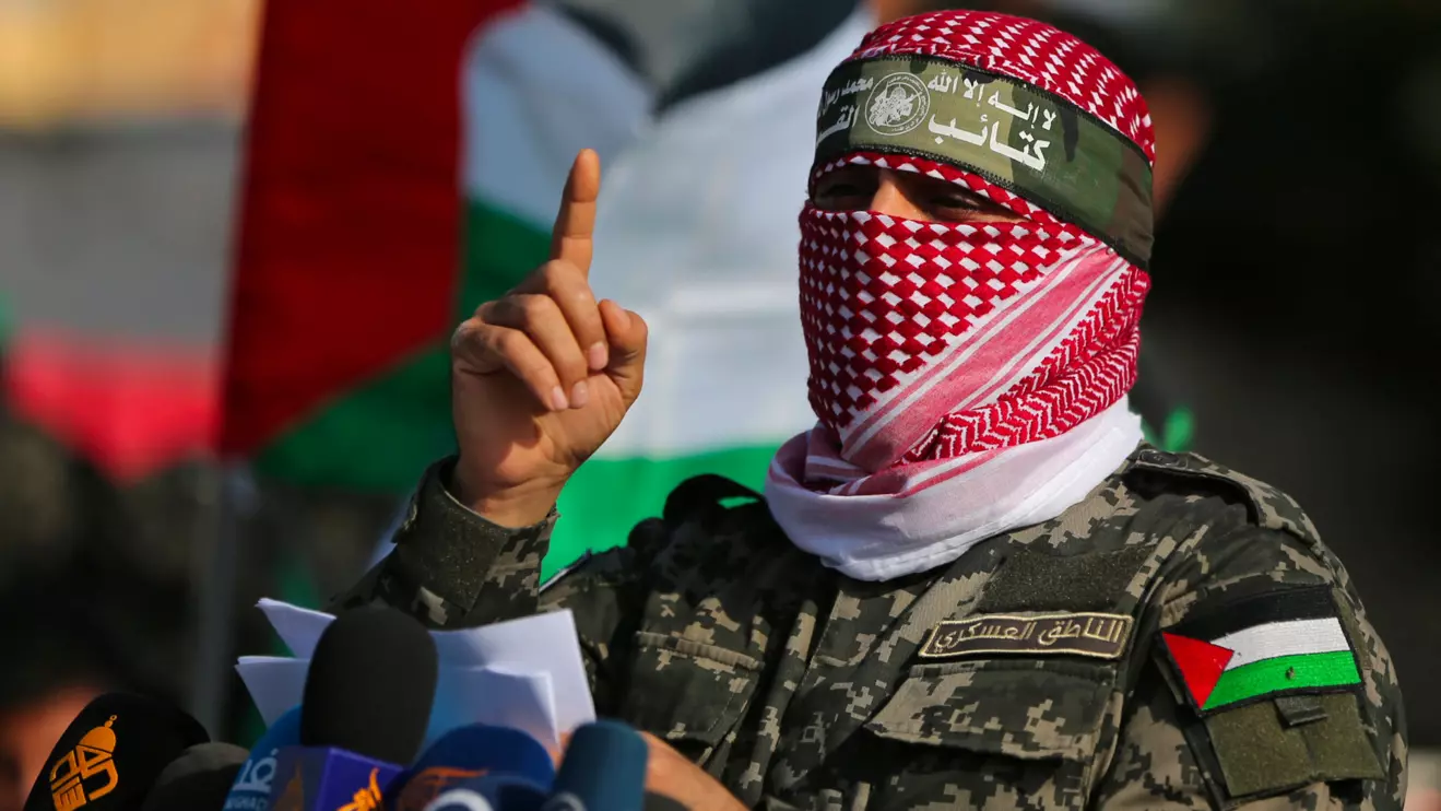 Abu Ubaida, the spokesman of the Izz el-Deen al-Qassam Brigades, gestures as he speaks during an anti-Israel military show in the southern Gaza Strip November 11, 2019. Reuters/Ibraheem Abu Mustafa