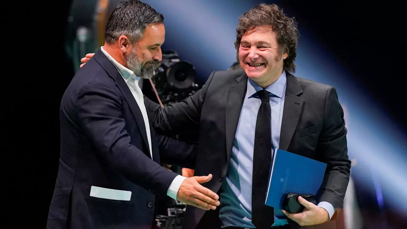 Spanish far-right Vox party leader Santiago Abascal greets Argentina's President Javier Milei during a rally organised by the Vox party ahead of the European elections, with various far-right leaders, in Madrid, May 19, 2024. Reuters/Ana Beltran