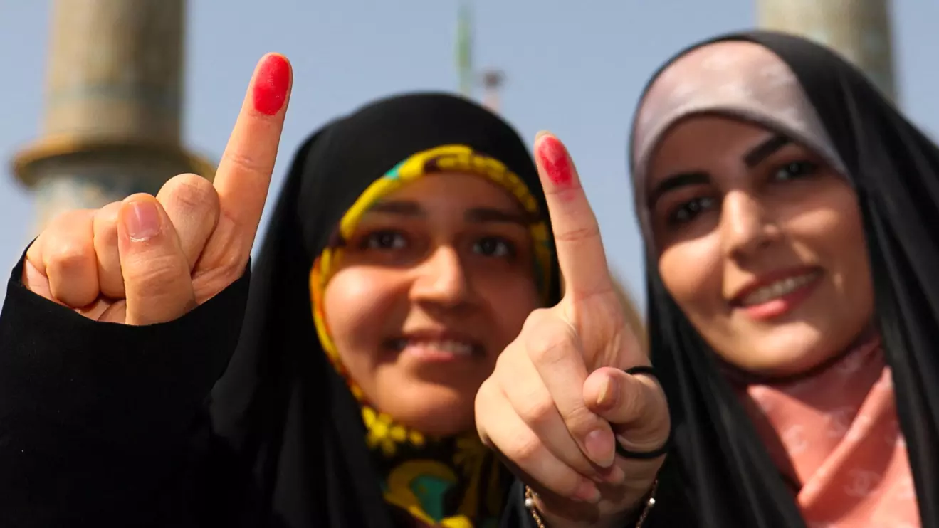 Women show their ink-stained fingers during the run-off presidential election between Masoud Pezeshkian and Saeed Jalili in Tehran, Iran, July 5, 2024. Majid Asgaripour/WANA (West Asia News Agency) via Reuters