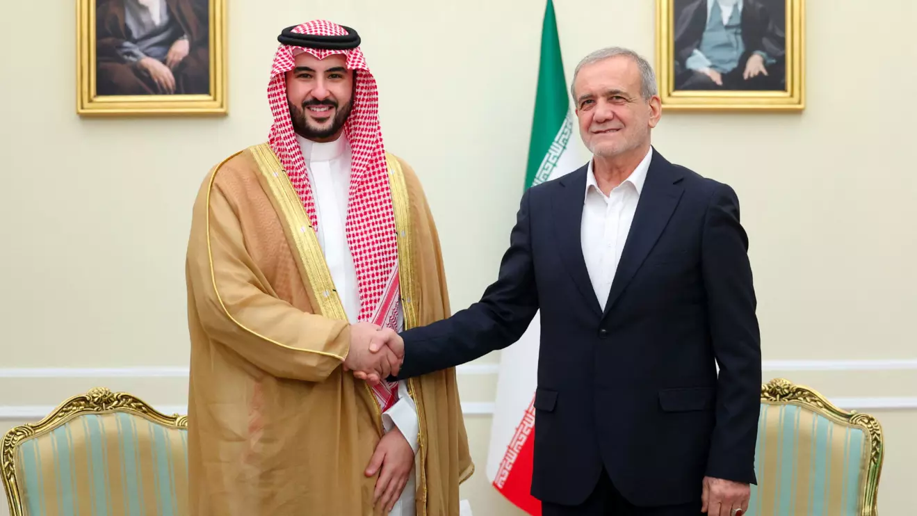 Iranian President Masoud Pezeshkian shakes hands with Saudi Defence Minister Prince Khalid bin Salman in Tehran, Iran, April 17, 2025. Iran's Presidential website/WANA (West Asia News Agency)/Handout via Reuters