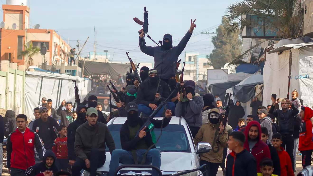 Hamas militants celebrate, Khan Younis, January 19, 2025. Reuters/Mohammed Salem