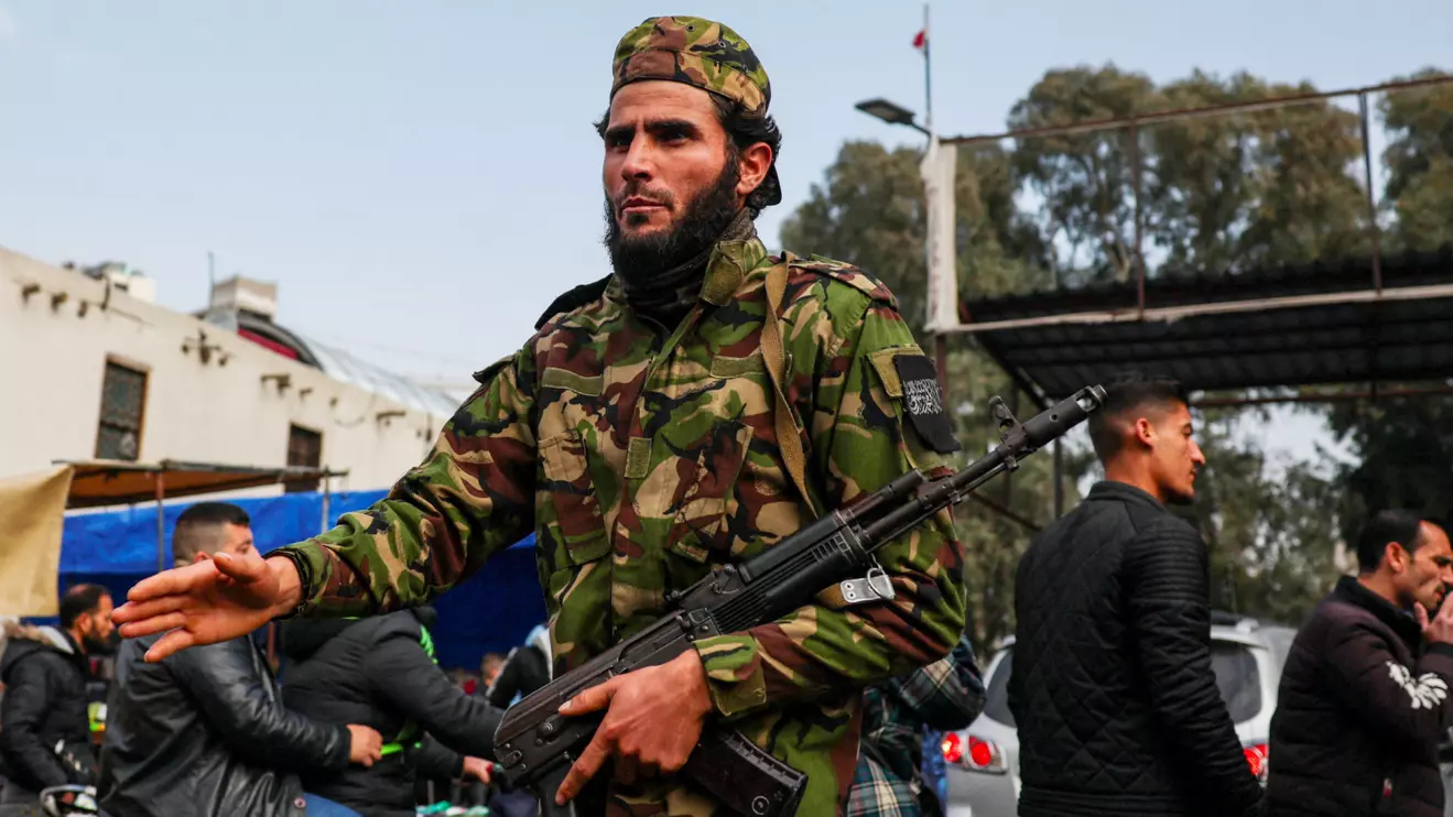 A fighter of the ruling Syrian body carries a rifle, after Syria's Bashar al-Assad was ousted, in Damascus, Syria, December 26, 2024. Reuters/Amr Abdallah Dalsh