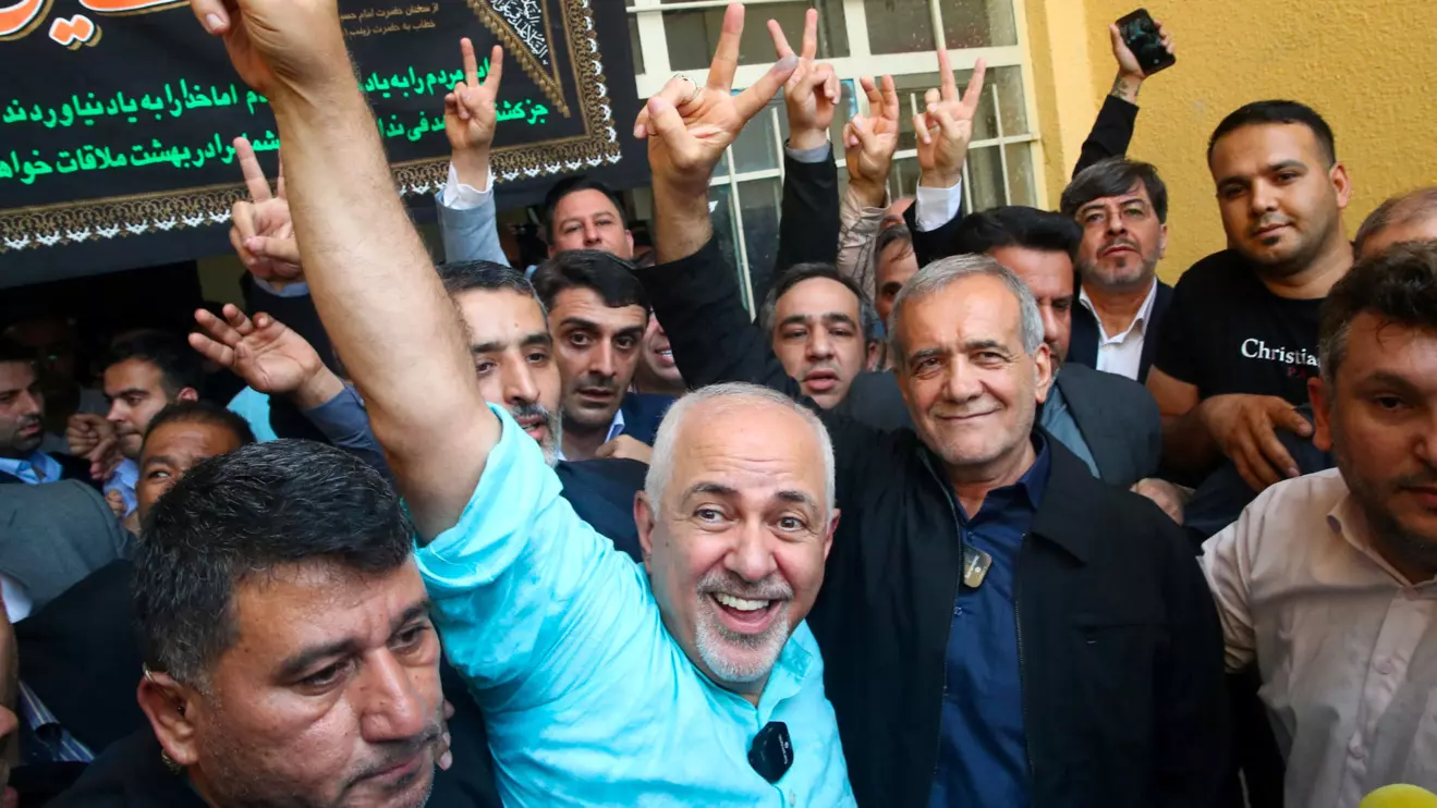 Iranian presidential candidate Masoud Pezeshkian waves at the crowd during the run-off presidential election between him and Saeed Jalili, in Tehran, Iran, July 5, 2024. Saeed Zareian/pool/WANA (West Asia News Agency) via Reuters 