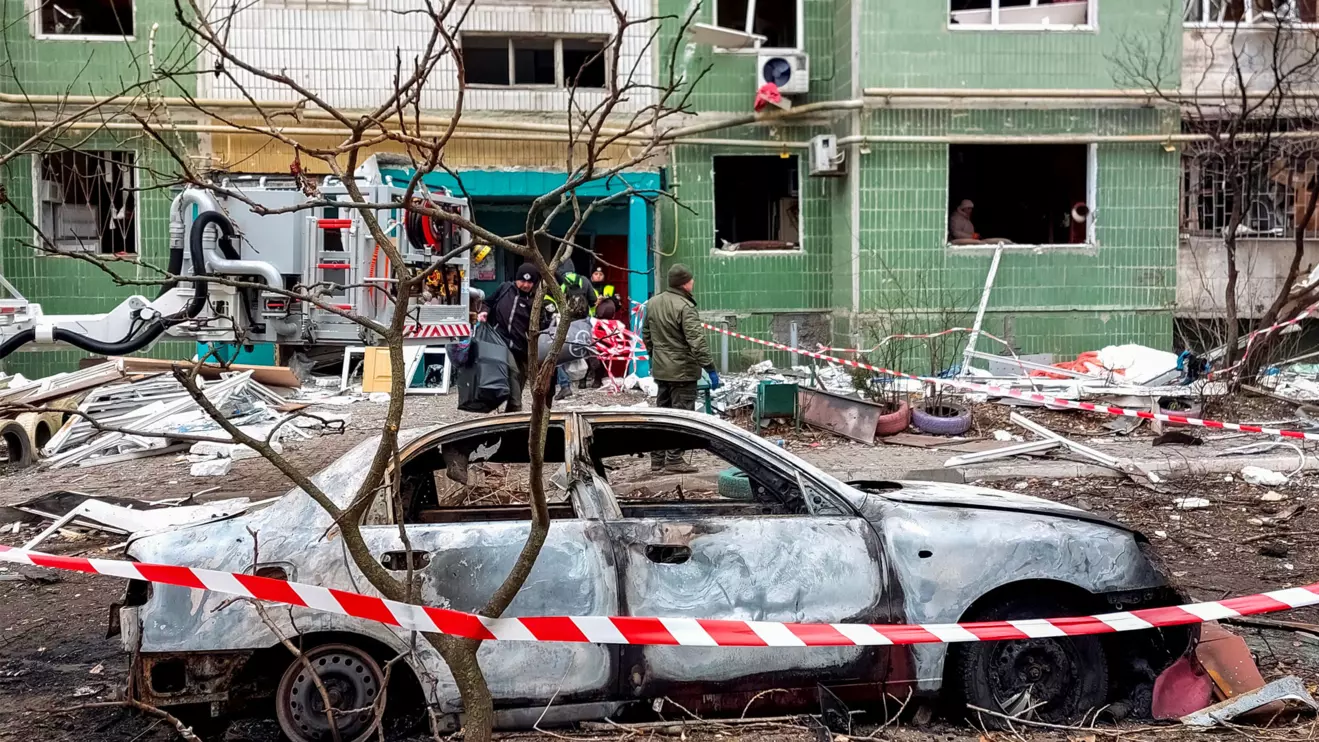 A view shows a destroyed car in front of a residential building, which was damaged by a Russian missile strike, amid Russia's attack on Ukraine, in Sumy, Ukraine November 18, 2024, Reuters