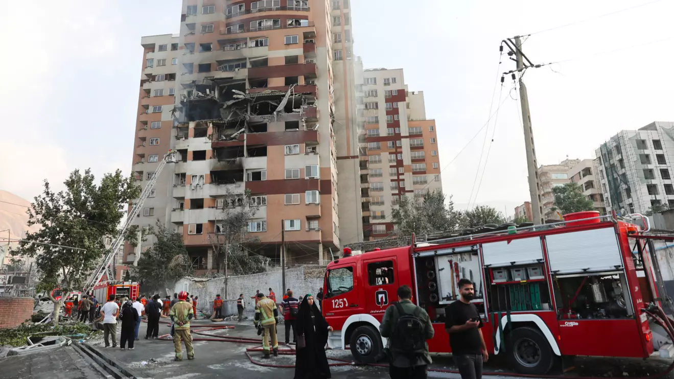 Firefighters work at the scene of a damaged building in the aftermath of Israeli strikes, in Tehran, Iran, June 13, 2025. Majid Asgaripour/WANA (West Asia News Agency) via Reuters