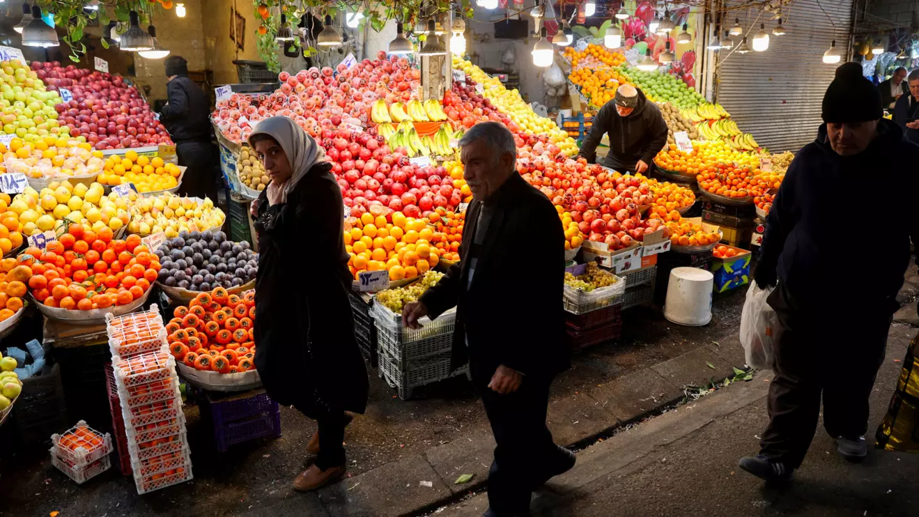 People walk through a local market as the value of the Iranian rial drops, in Tehran, Iran, December 20, 2025. Majid Asgaripour/WANA (West Asia News Agency) via Reuters
