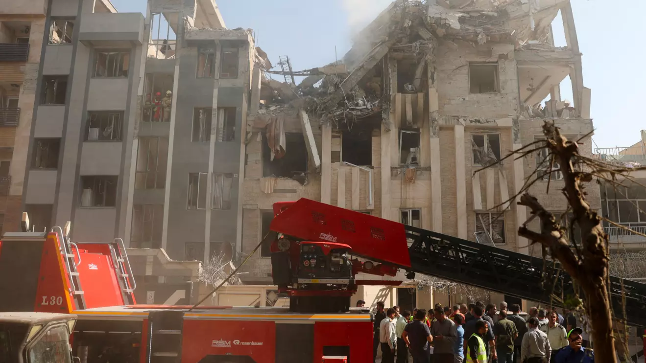 Rescuers work at the scene of a damaged building in the aftermath of Israeli strikes, in Tehran, Iran, June 13, 2025. Majid Asgaripour/WANA (West Asia News Agency) via Reuters