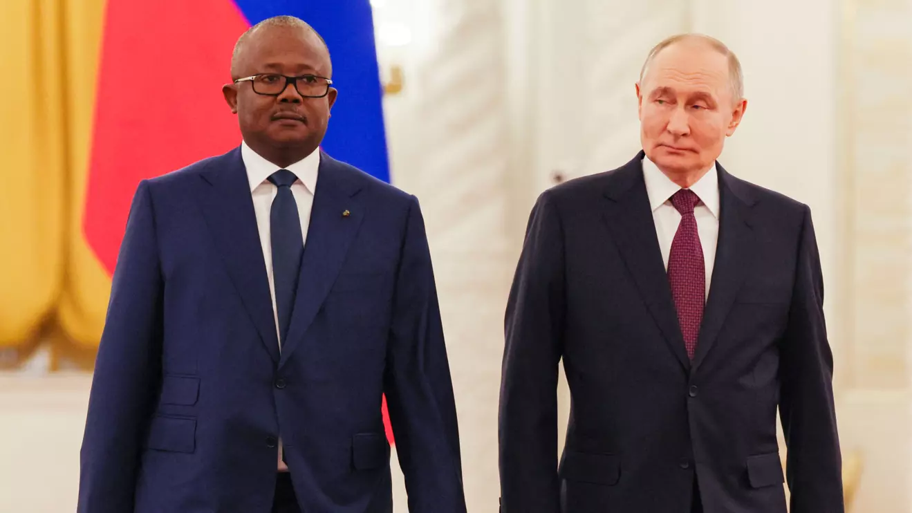 Russian president Vladimir Putin walks with Guinea-Bissau's President Umaro Sissoco Embalo during their meeting at the Kremlin in Moscow, Russia, February 26, 2025. Yuri Kochetkov/Reuters 