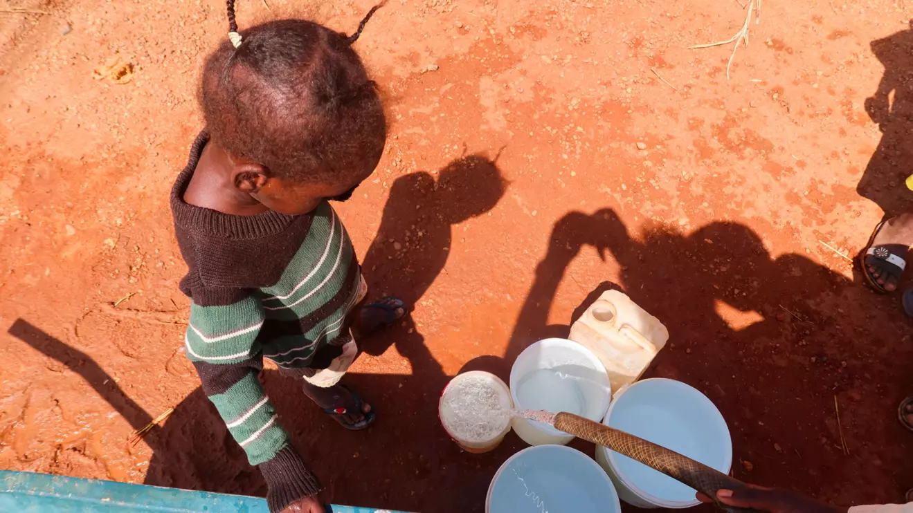 A child waits for her turn to get water in Khartoum Bahri, Hattab area, Omdurman, Sudan, November 9, 2024. Reuters/El Tayeb Siddig