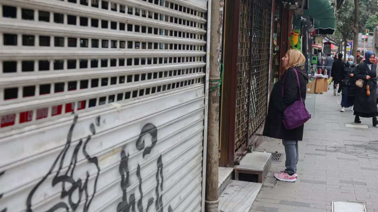 A woman looks at a closed jewelry store, amid the opposition's calls for a mass economic boycott following the arrest of Istanbul Mayor Ekrem Imamoglu that sparked nationwide protests in Istanbul, Turkey, April 2, 2025. Reuters/Louisa Gouliamaki