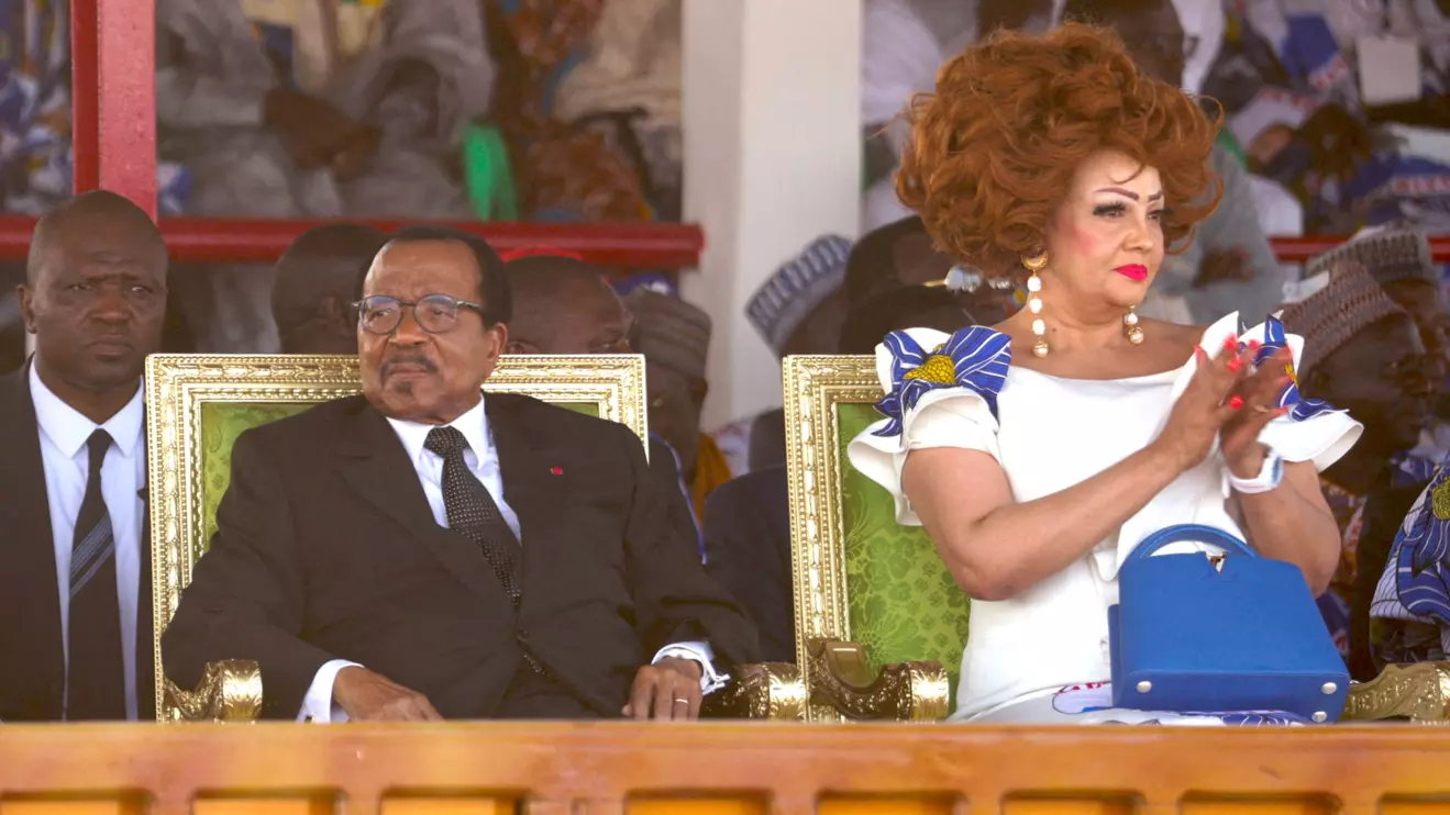Cameroon's 92-year-old President Paul Biya, who is seeking an eighth term, sits with his wife Chantal Biya during the launch of his electoral campaign, in Maroua, Cameroon, October 7, 2025. Reuters/Desire Danga Essigue
