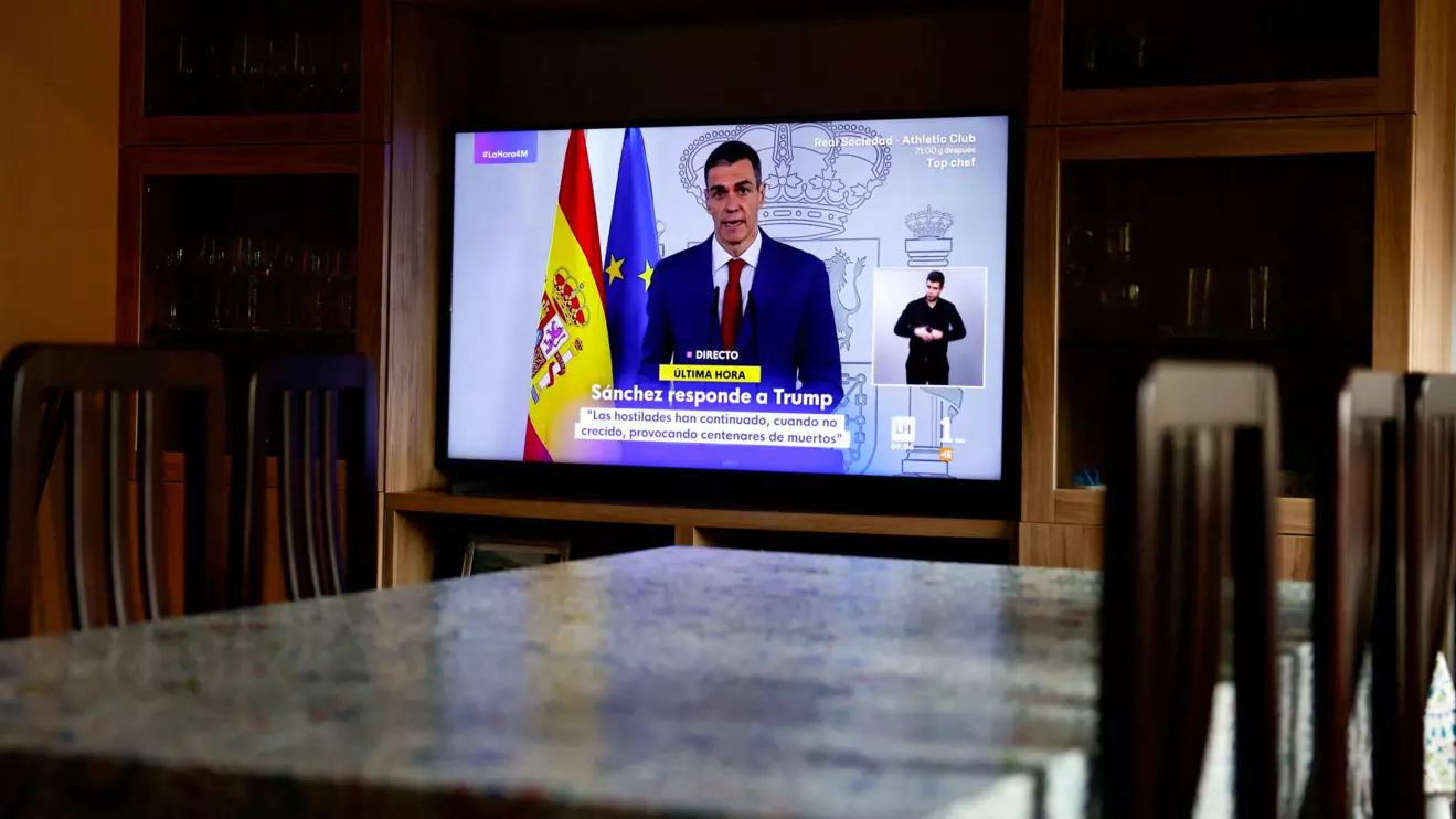 A TV screen shows a live broadcast of Spain's Prime Minister Pedro Sanchez, as he delivers an institutional statement to address the latest international developments, after U.S. President Donald Trump said on Tuesday that the U.S. would cut off all trade with Spain after the European country refused to let the U.S. military use its bases for missions linked to strikes on Iran, at a house in Ronda, Spain, March 4, 2026. Reuters/Jon Nazca